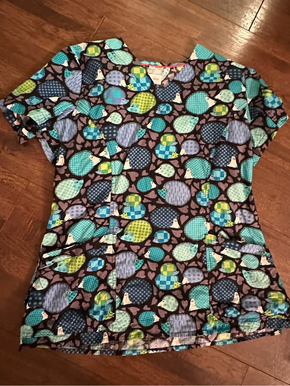 White Cross Women’s Printed Scrub Top in Teal, Blue and Green